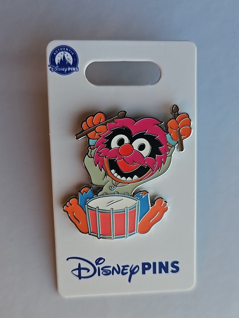 Disney enamel pin of Animal from The Muppets playing a drum